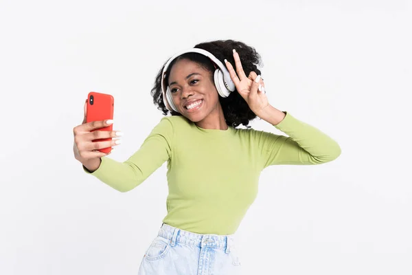Young Black Woman Gesturing While Taking Selfie Photo Cellphone Isolated — Stockfoto