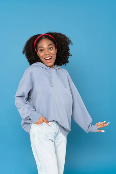 Young Black Woman Wearing Headband Smiling While Dancing Isolated Blue — Fotografia de Stock