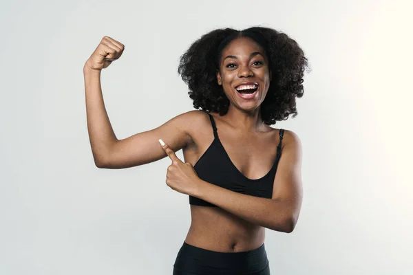 Young Black Woman Laughing Pointing Finger Her Bicep Isolated White — Fotografia de Stock