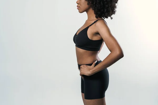 Young Black Woman Sportswear Posing Looking Aside Isolated White Background — стоковое фото