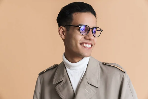 Young Middle Eastern Man Eyeglasses Smiling Looking Aside Isolated Beige — 스톡 사진