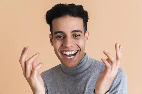 Young Middle Eastern Man Laughing While Gesturing Camera Isolated Beige — Stock fotografie