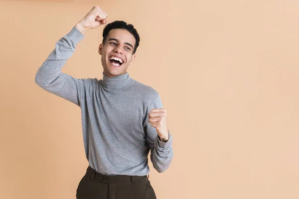 Young Middle Eastern Man Laughing While Making Winner Gesture Isolated — Stock Photo, Image
