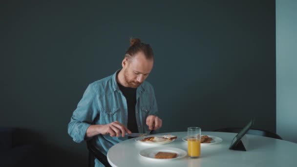 Handsome Blond Man Eating Frying Eggs Bacon Morning Home — Stockvideo
