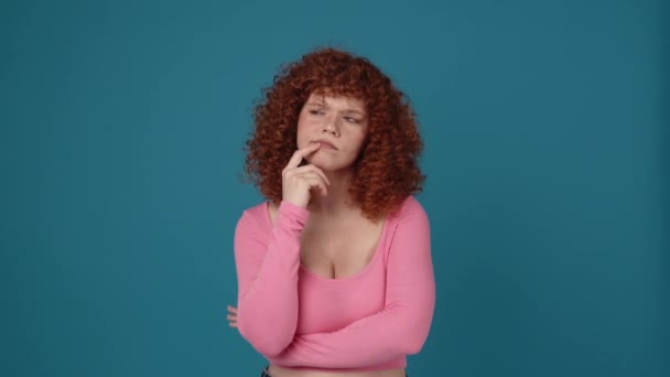 Meditative Curly Haired Redhead Woman Wearing Pink Shirt Disagrees Something – stockvideo