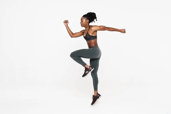 Black Young Sportswoman Doing Exercise While Working Out Isolated White — ストック写真