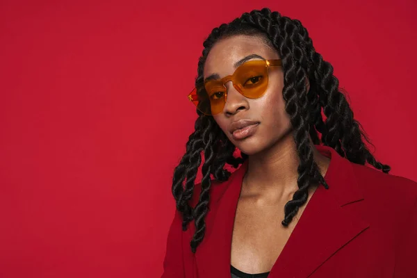 Black Young Woman Wearing Jacket Posing Looking Camera Isolated Red — Foto Stock