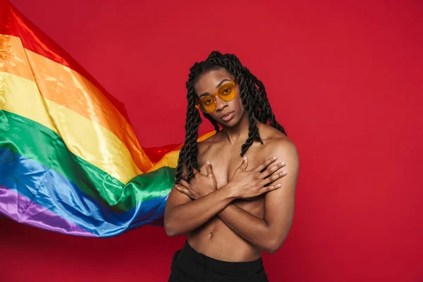 Black Shirtless Woman Posing Rainbow Flag Covering Her Bust Isolated — Foto de Stock