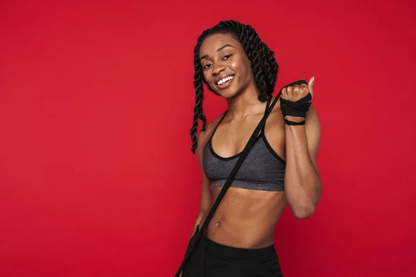 Young Black Sportswoman Smiling While Posing Rope Isolated Red Background — Photo