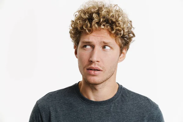 Young Puzzled Man Curly Hair Posing Looking Aside Isolated White — Stock Photo, Image