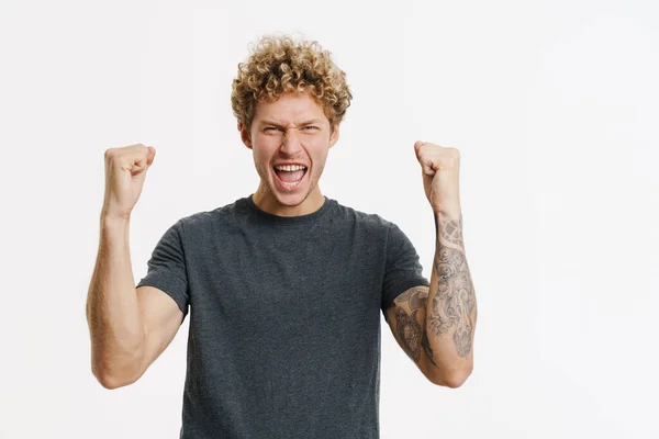 Young Blonde Man Screaming While Making Winner Gesture Isolated White — Photo