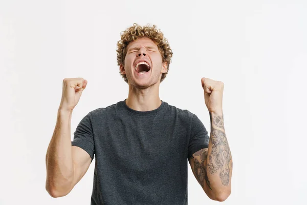 Young Blonde Man Screaming While Making Winner Gesture Isolated White — Photo