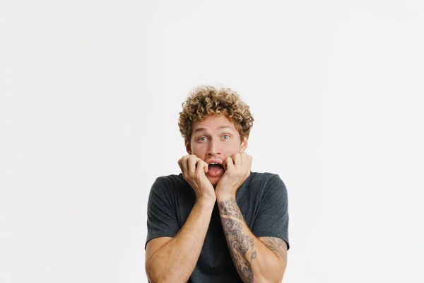 Young Curly Man Expressing Surprise Screaming Camera Isolated White Wall — 图库照片
