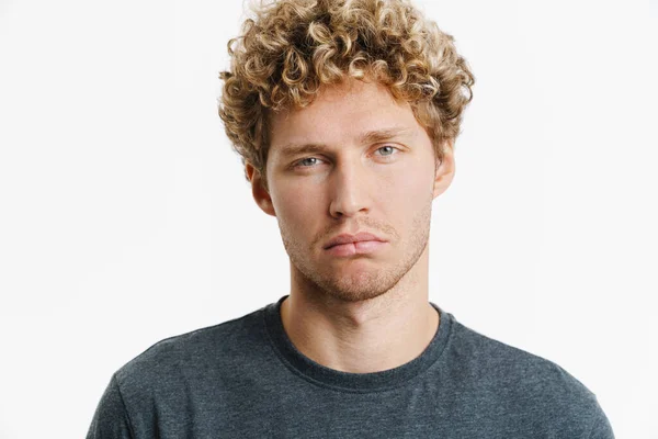 Young Puzzled Man Curly Hair Posing Looking Camera Isolated White — стоковое фото