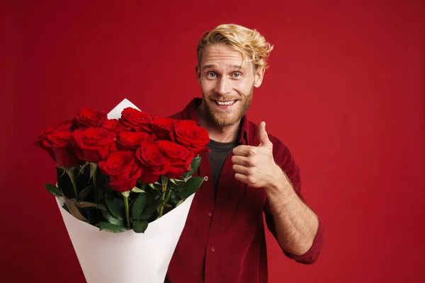 White Bearded Man Showing Thumb While Posing Roses Isolated Red — 图库照片