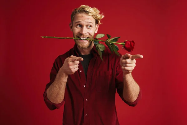 White Man Pointing Fingers Aside While Holding Rose His Mouth — Stock Photo, Image