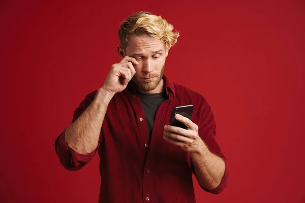 White Bearded Man Crying While Using Mobile Phone Isolated Red —  Fotos de Stock