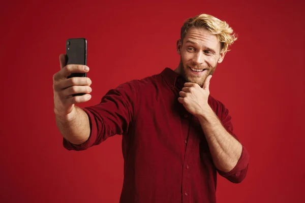 White Bearded Man Smiling While Taking Selfie Cellphone Isolated Red —  Fotos de Stock
