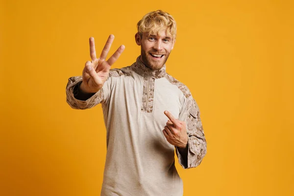 White Military Man Showing Her Fingers Smiling Camera Isolated Yellow — Stok fotoğraf