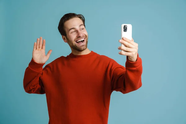 Young Bristle Man Gesturing Taking Selfie Cellphone Isolated Blue Background — Foto de Stock