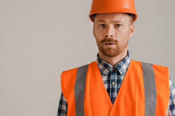 White Man Worker Wearing Helmet Vest Looking Camera Isolated Grey — Fotografia de Stock