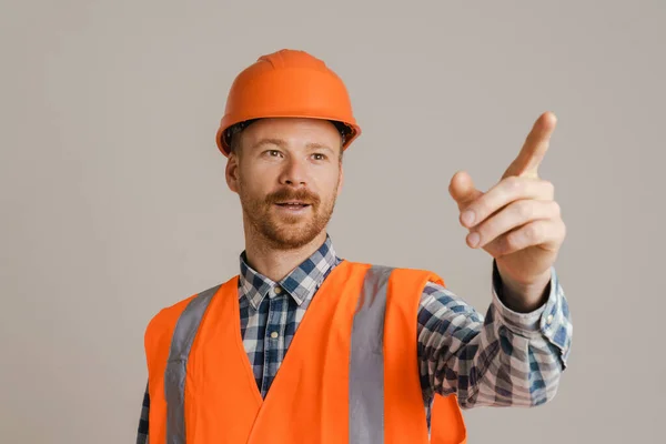 White Man Worker Wearing Helmet Pointing Finger Aside Isolated Grey — Φωτογραφία Αρχείου