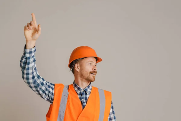 White Man Worker Wearing Helmet Pointing Finger Upward Isolated Grey — Φωτογραφία Αρχείου