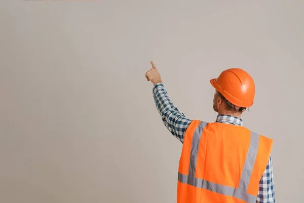 White Man Worker Wearing Helmet Pointing Finger Upward Isolated Grey —  Fotos de Stock