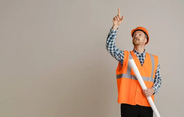 White Man Builder Pointing Finger Upward While Holding Drawing Isolated — Fotografia de Stock