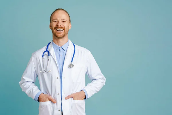 White Male Doctor Wearing Lab Coat Laughing Camera Isolated Blue — Fotografie, imagine de stoc