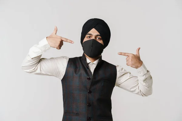 South Asian Man Wearing Turban Pointing Fingers His Face Mask — Stockfoto