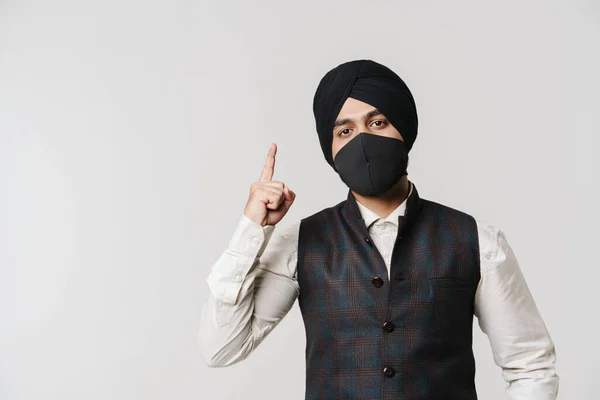 South Asian Man Wearing Turban Face Mask Pointing Finger Upward — Foto Stock