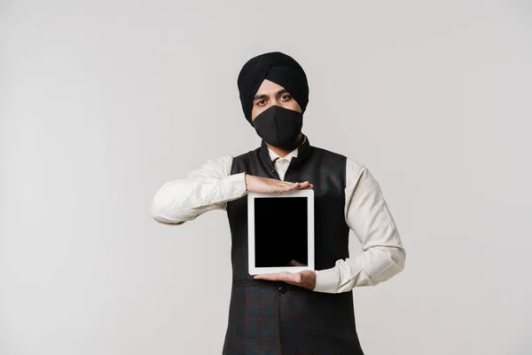 South Asian Man Wearing Turban Face Mask Showing Tablet Computer — Fotografia de Stock