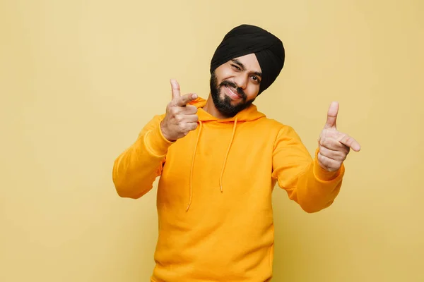 Bearded South Asian Man Winking Pointing Fingers Camera Isolated Yellow — 스톡 사진