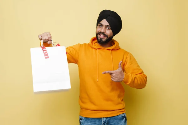Bearded South Asian Man Pointing Finger His Shopping Bags Isolated — Stockfoto