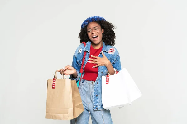 Black Woman Laughing Gesturing While Posing Shopping Bags Isolated White — Stock Fotó