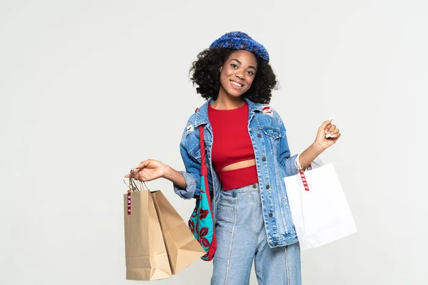 Young Black Woman Smiling While Posing Shopping Bags Isolated White — Stockfoto