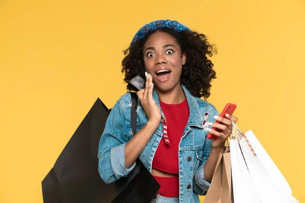 Black Woman Using Cellphone While Posing Credit Card Shopping Bags — Stock Fotó