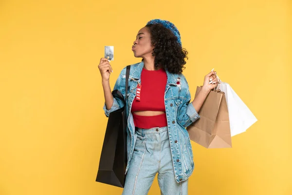Young Black Woman Posing Credit Card Shopping Bags Isolated Yellow — Stockfoto