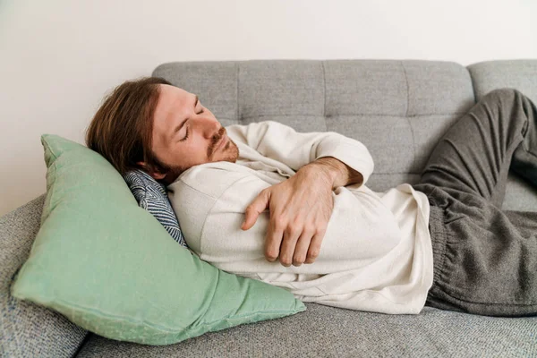 Ginger European Man Feeling Sick While Lying Couch Home — 스톡 사진