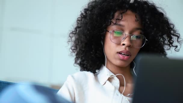 Tired Curly Haired Woman Working Laptop Headphones Stretching While Sitting — Stockvideo