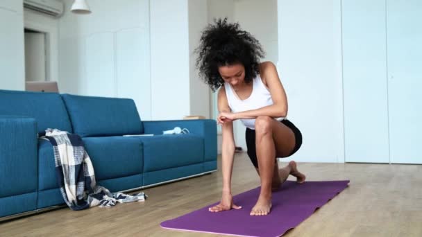 Handsome Curly Haired Woman Stretching Her Leg Yoga Mat Home — Video Stock