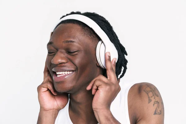 Young Black Man Headphones Smiling While Listening Music Isolated White — Stockfoto