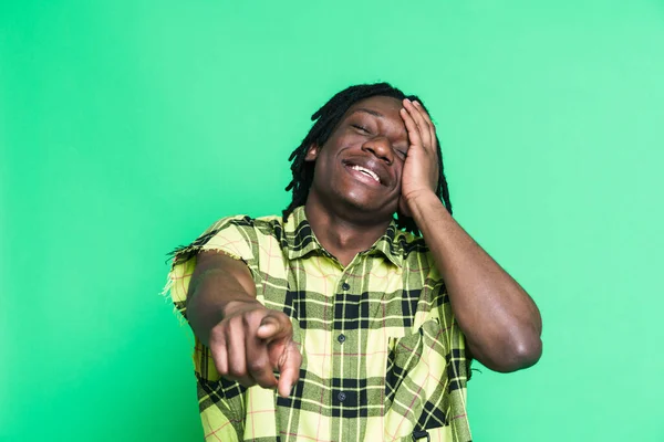 Young Black Man Laughing Pointing Finger Camera Isolated Green Background — Stock Photo, Image