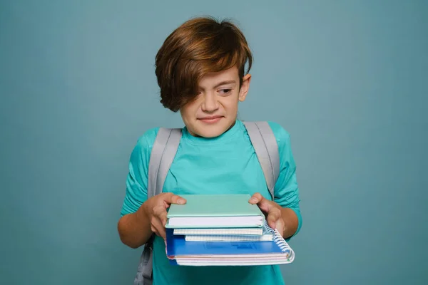 Ginger Displeased Boy Backpack Posing Exercise Books Isolated Blue Wall — Stockfoto