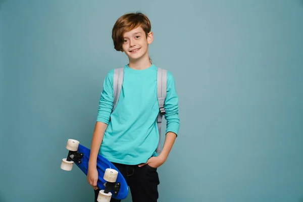 Ginger White Boy Smiling While Posing Skateboard Isolated Blue Wall — Foto de Stock
