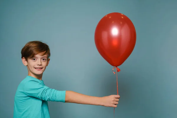 Ginger White Boy Smiling While Posing Red Balloon Isolated Blue — Foto de Stock