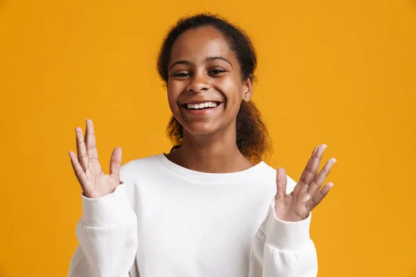 Brunette Black Girl Gesturing Smiling Camera Isolated Yellow Background — Stockfoto