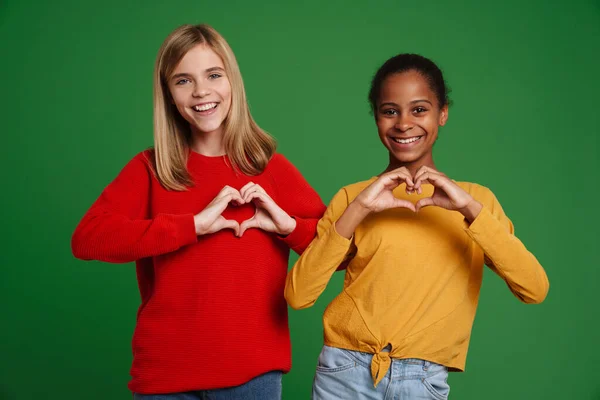 Multiracial Two Girls Smiling While Showing Heart Gesture Together Isolated — Stock fotografie
