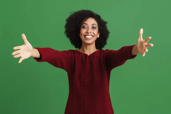 Black Young Woman Wearing Sweater Stretching Her Arms Camera Isolated — Zdjęcie stockowe